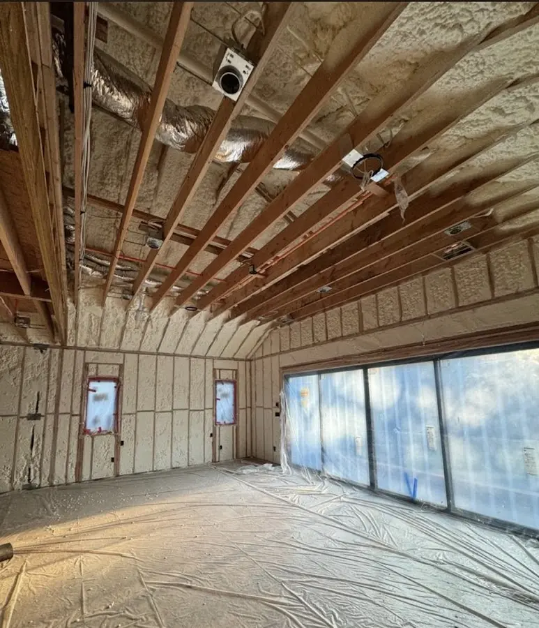 Interior walls and ceiling insulated with spray foam during new construction in Crete